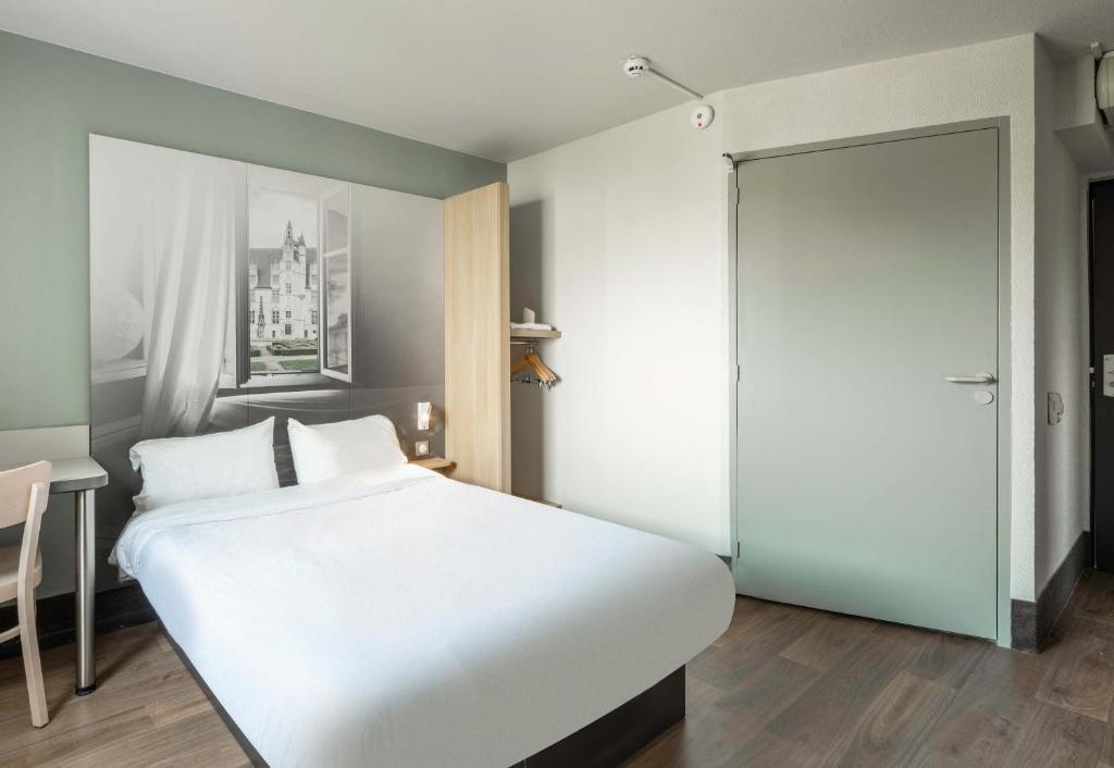 Postel nebo postele na pokoji v ubytování B&B HOTEL Beauvais