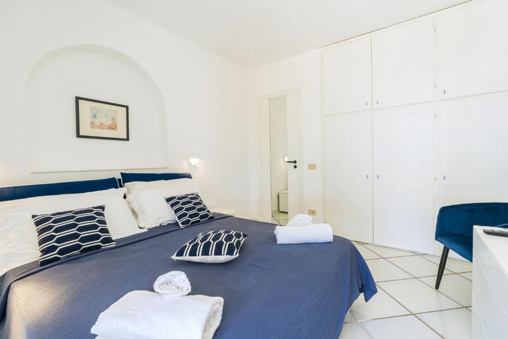Ένα ή περισσότερα κρεβάτια σε δωμάτιο στο Gardenia Mare Apartments
