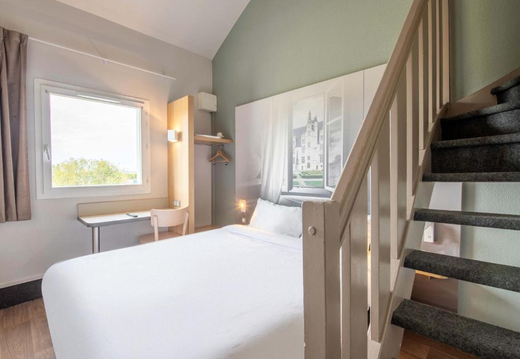 Postel nebo postele na pokoji v ubytování B&B HOTEL Beauvais