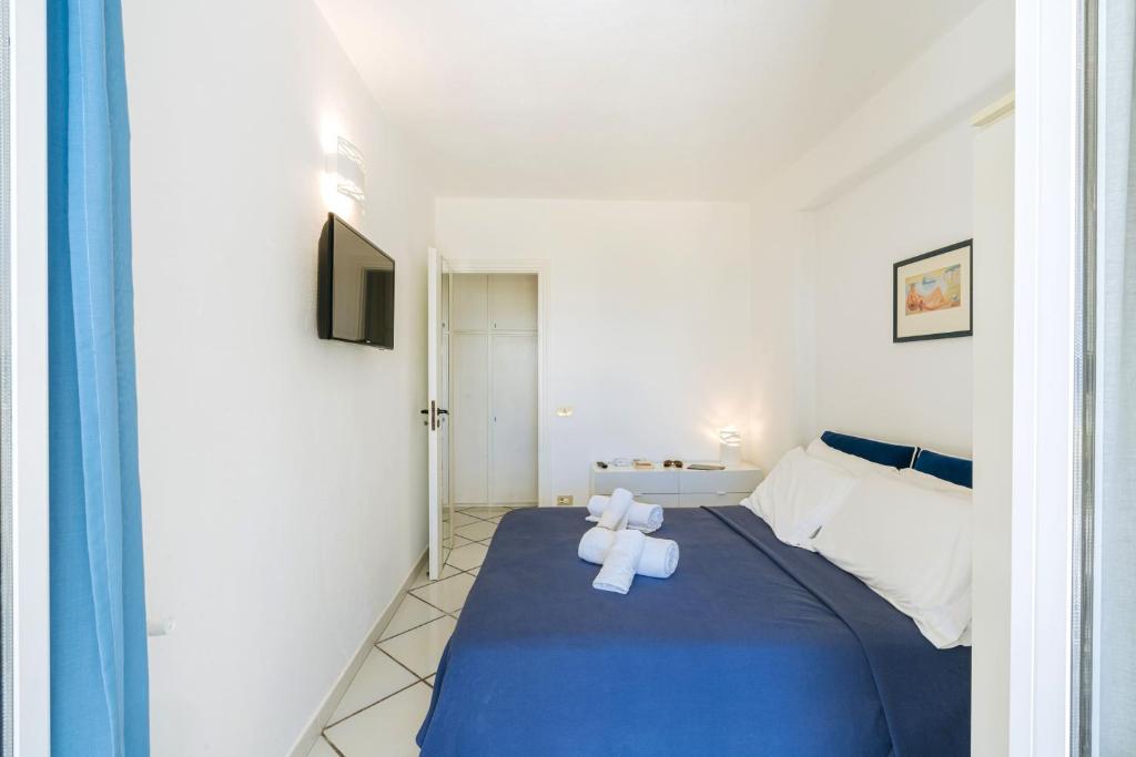 Ένα ή περισσότερα κρεβάτια σε δωμάτιο στο Gardenia Mare Apartments