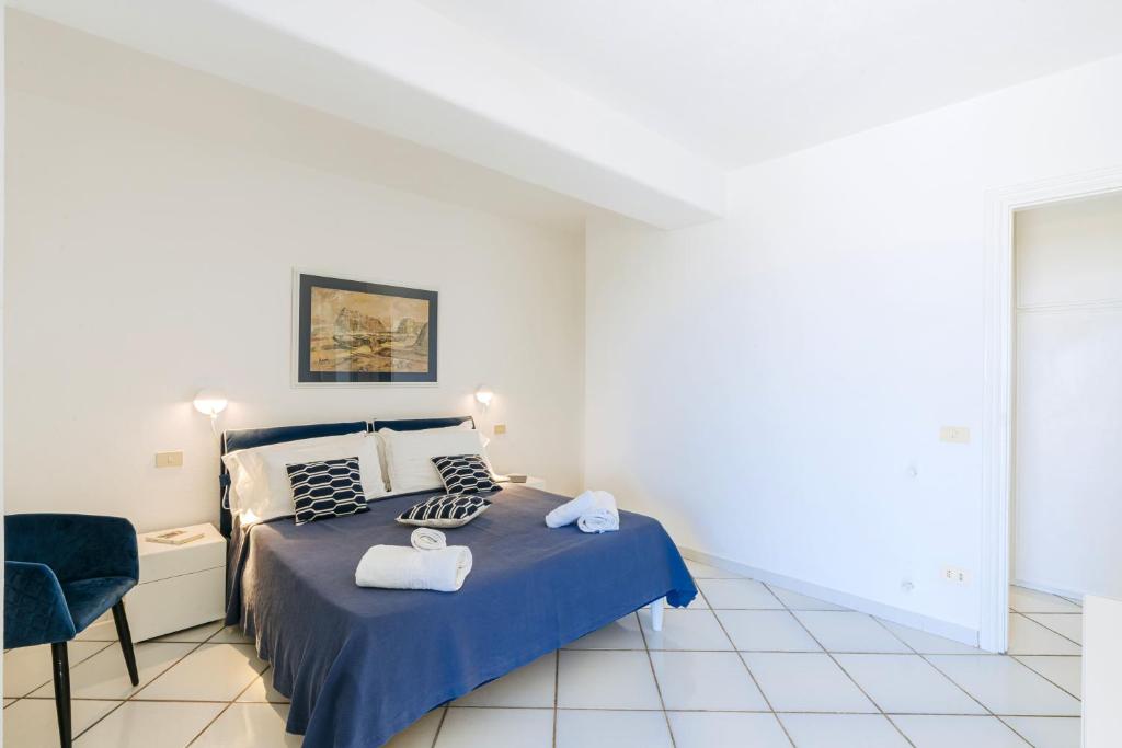 Ένα ή περισσότερα κρεβάτια σε δωμάτιο στο Gardenia Mare Apartments