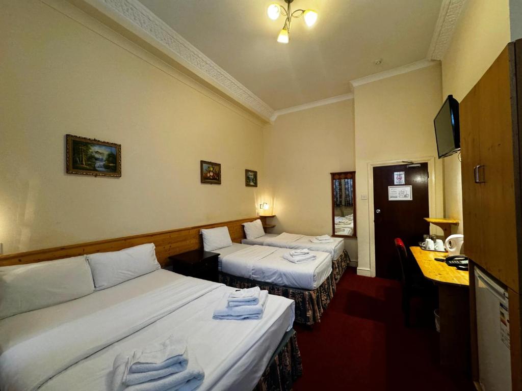 Letto o letti in una camera di Bridge Park Hotel