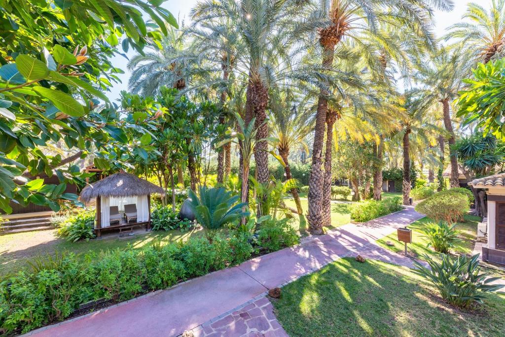 A garden outside Hotel Huerto del Cura