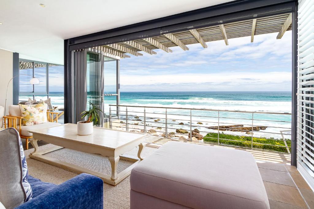 a living room with a view of the ocean at Villa Misty Cliffs in Scarborough