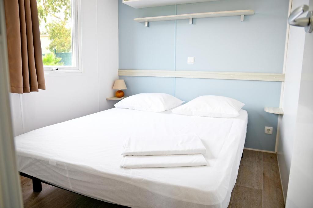 Postel nebo postele na pokoji v ubytování Camping Les Castors