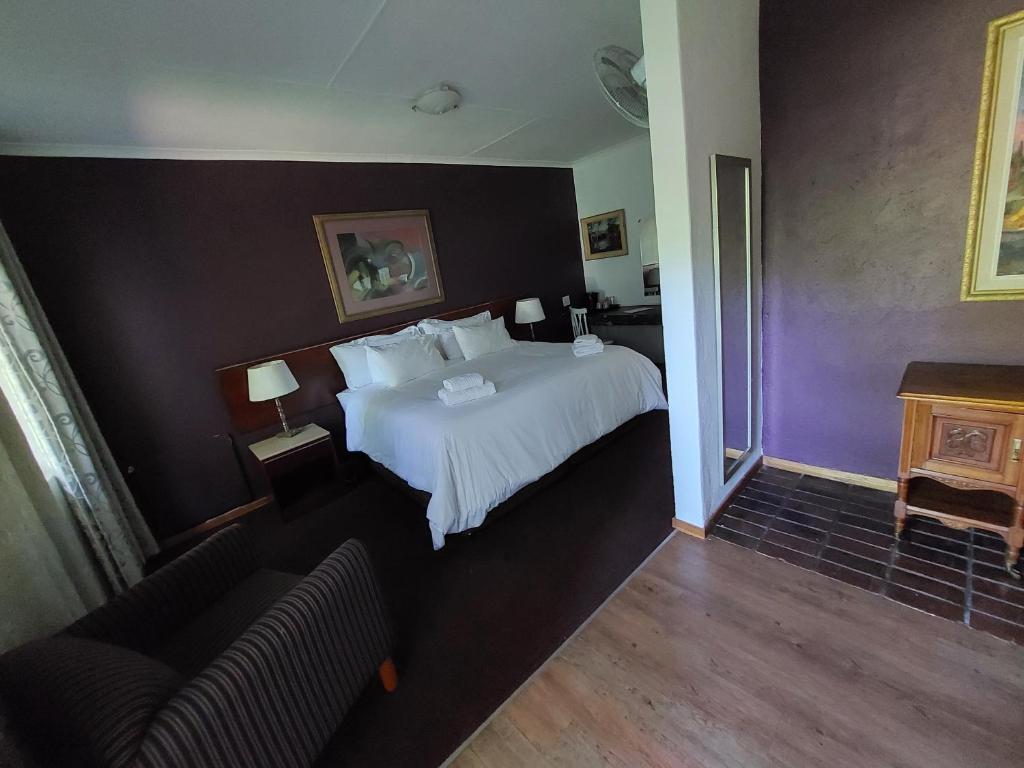 Postel nebo postele na pokoji v ubytování Wayside Lodge