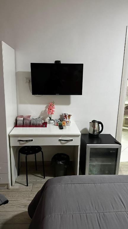 Łóżko lub łóżka w pokoju w obiekcie Napoli Relais