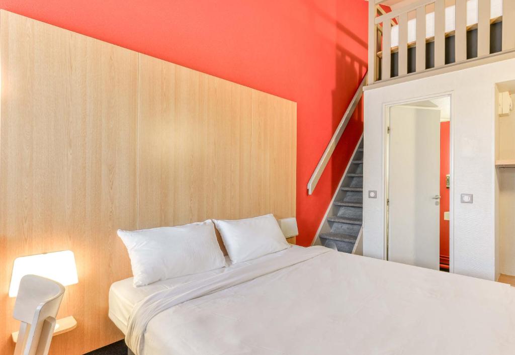 Postel nebo postele na pokoji v ubytování B&B HOTEL Montpellier 2