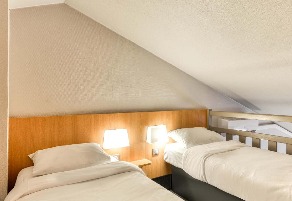 Postel nebo postele na pokoji v ubytování B&B HOTEL Montpellier 2