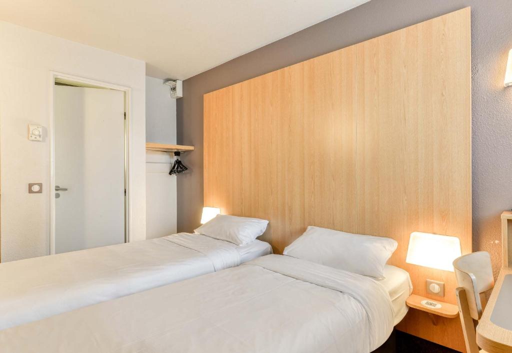 Postel nebo postele na pokoji v ubytování B&B HOTEL Montpellier 2