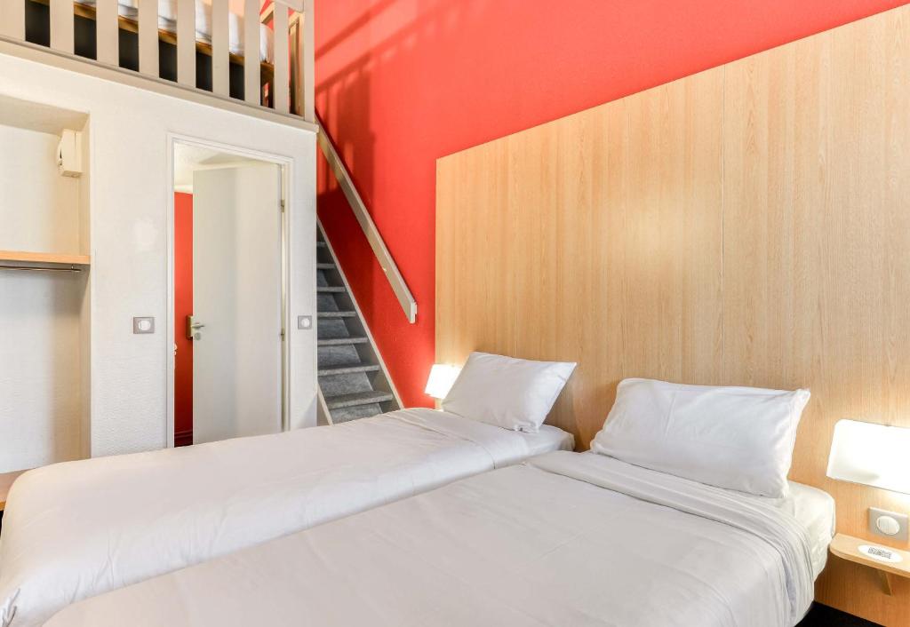 Postel nebo postele na pokoji v ubytování B&B HOTEL Montpellier 2