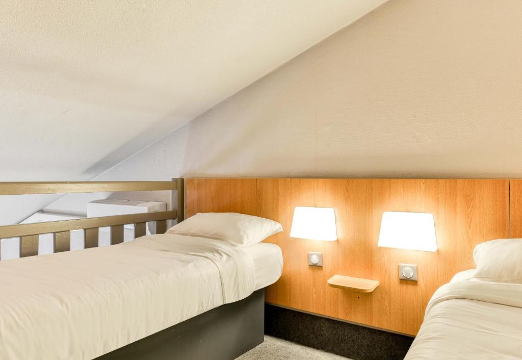 Postel nebo postele na pokoji v ubytování B&B HOTEL Montpellier 2