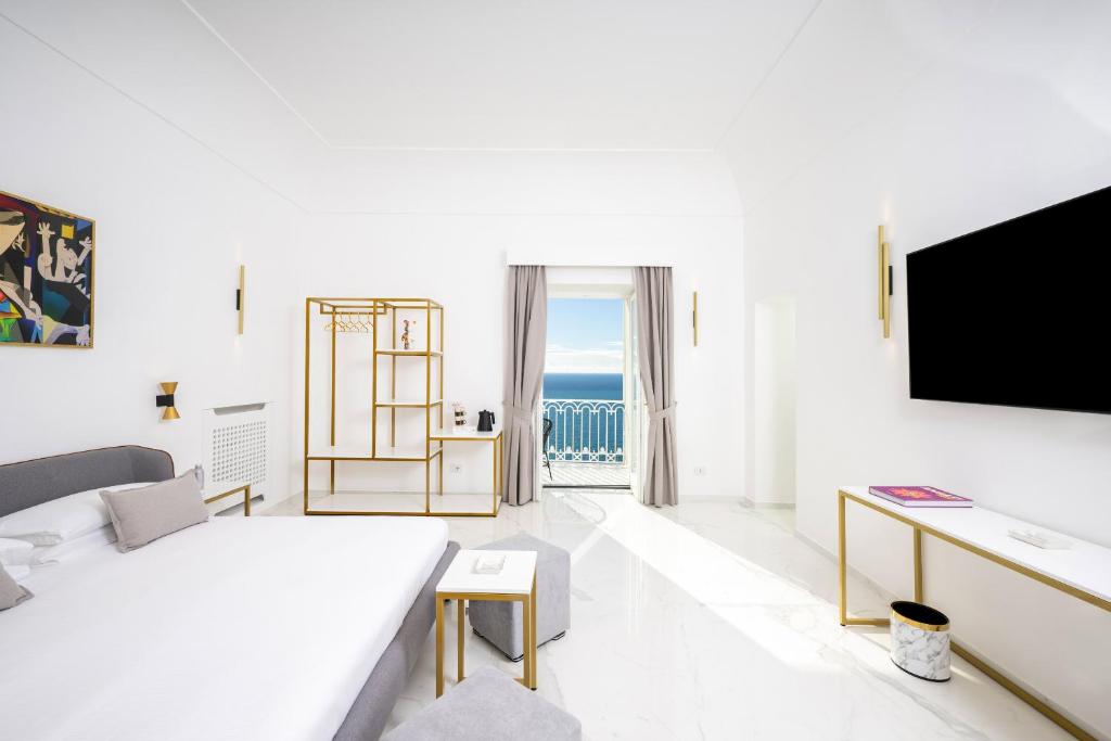 Postel nebo postele na pokoji v ubytování Gianlica Suites Positano