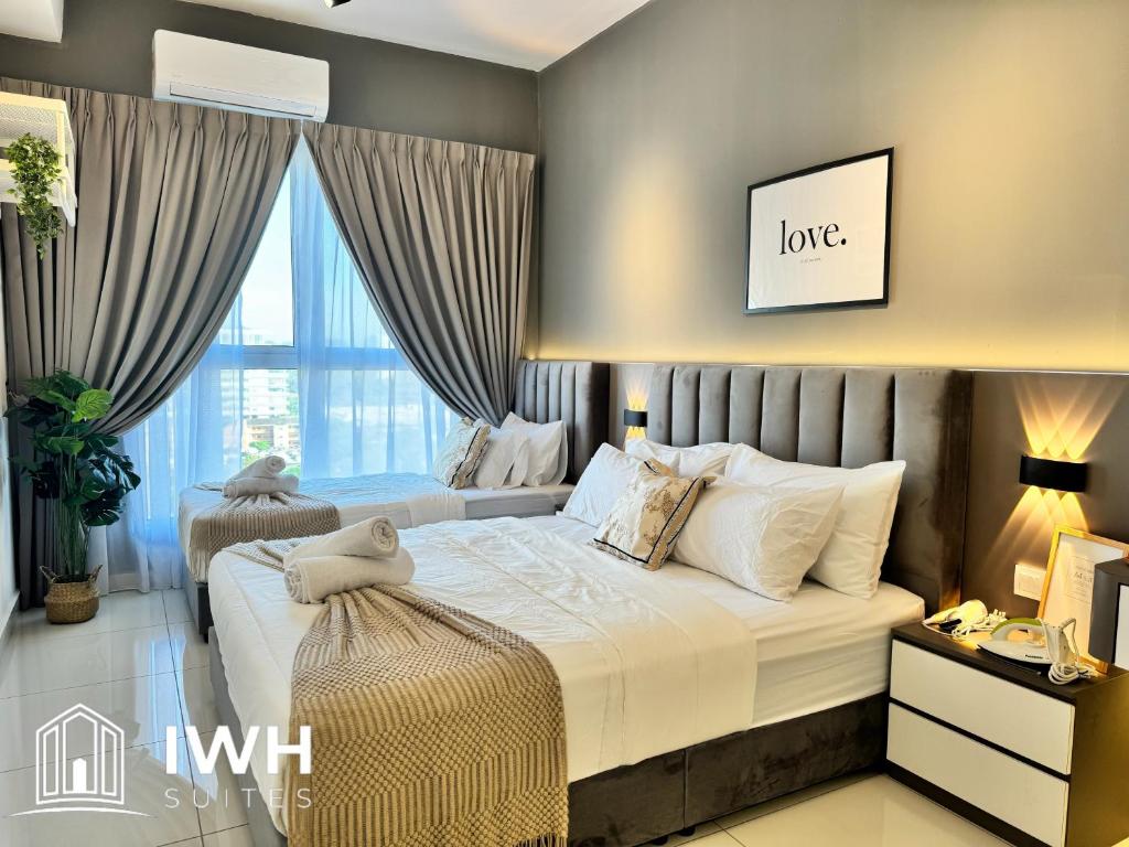 Postel nebo postele na pokoji v ubytování ICC Ipoh Town Premium Suites By IWH Suites