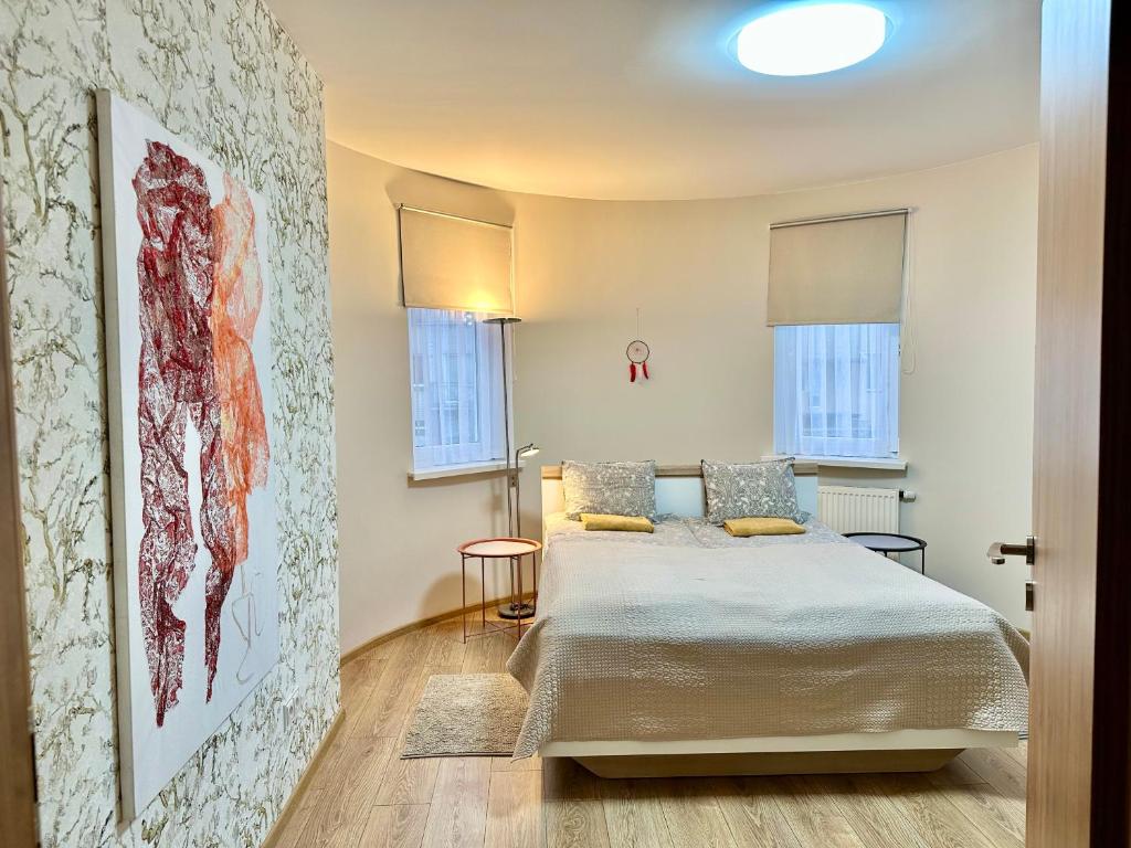 Postel nebo postele na pokoji v ubytování Japandi apartamentai