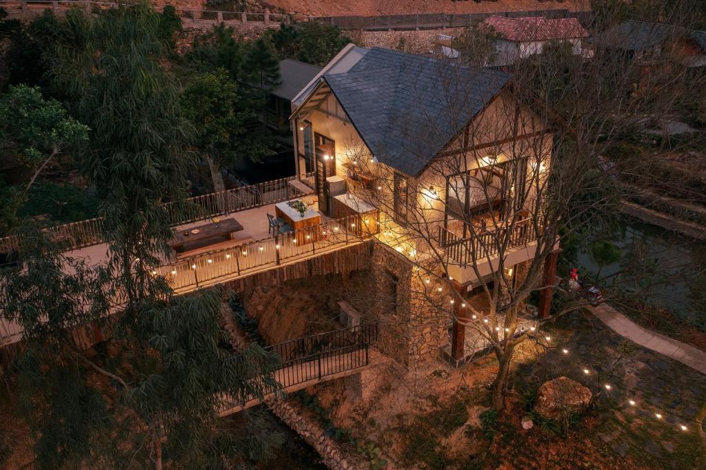 an aerial view of a house with lights on it at Quin home, into the forest, close to Noi Bai airport in Phú Hữu