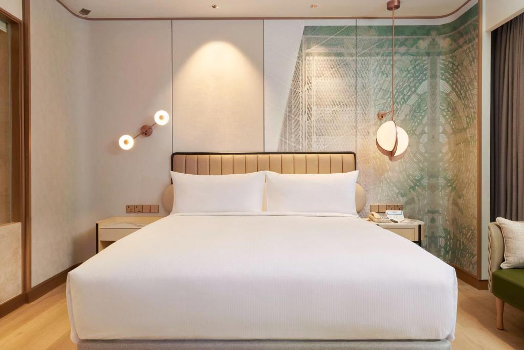 Postel nebo postele na pokoji v ubytování Hilton Petaling Jaya