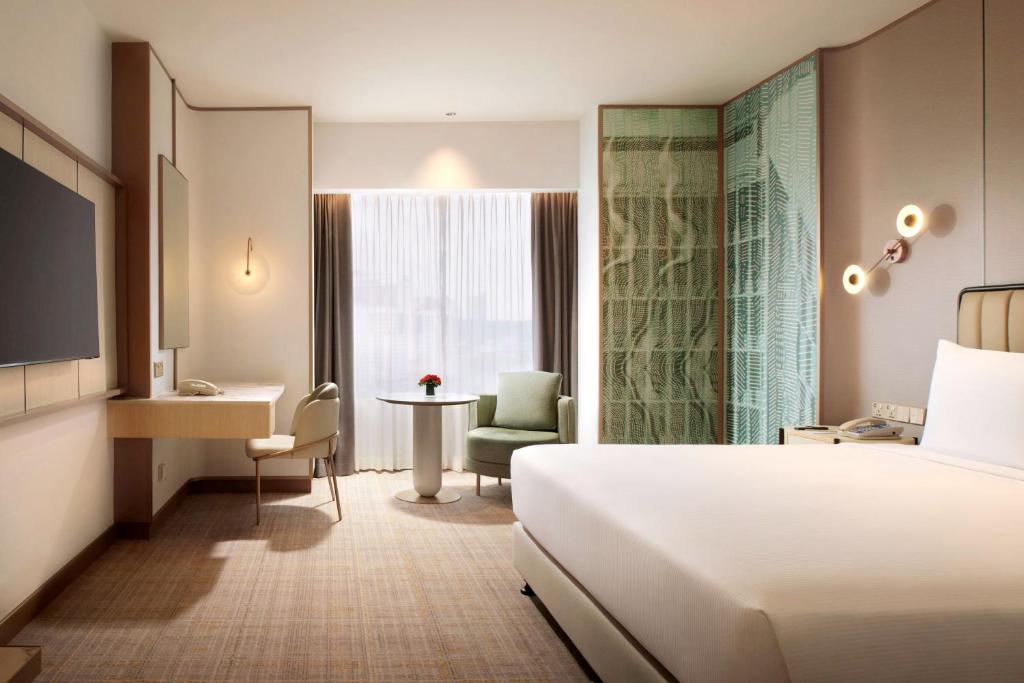 Postel nebo postele na pokoji v ubytování Hilton Petaling Jaya