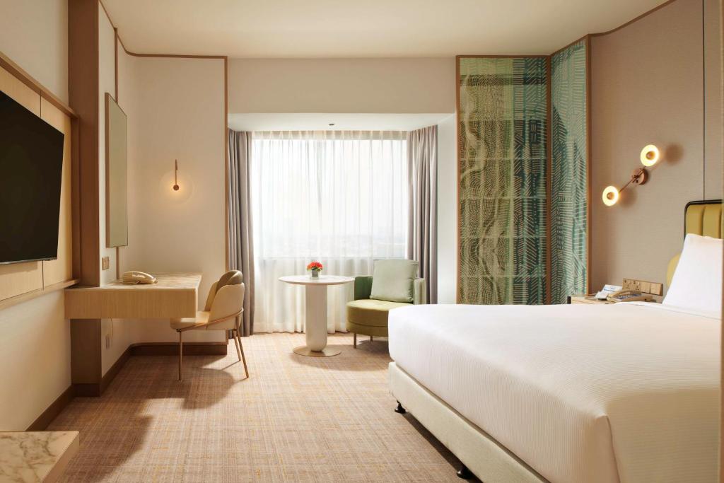 Postel nebo postele na pokoji v ubytování Hilton Petaling Jaya