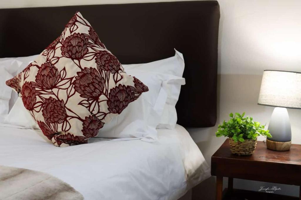 a pillow sitting on top of a bed at The Ultimate Lodge in Louis Trichardt