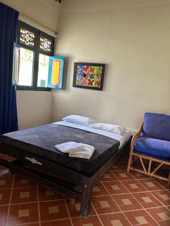 Postel nebo postele na pokoji v ubytování FINCA HOTEL TRADICION CAFETERA
