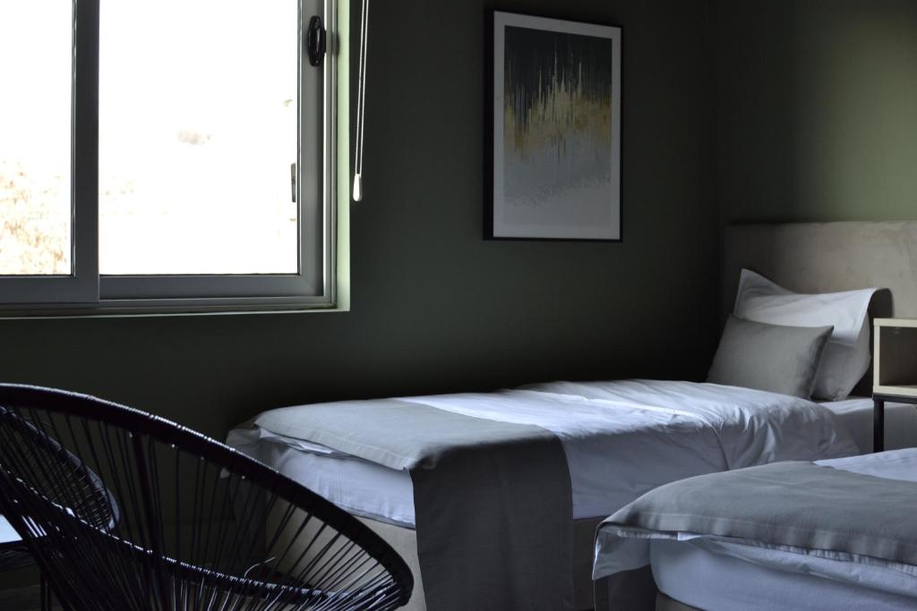 Postel nebo postele na pokoji v ubytování Hotel Pamela Concept