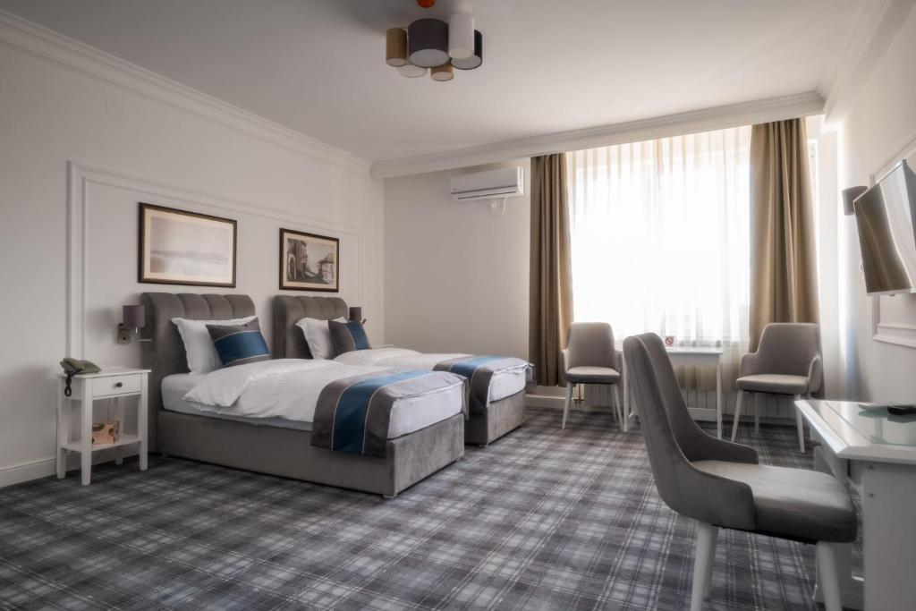 Letto o letti in una camera di Hotel Mio City