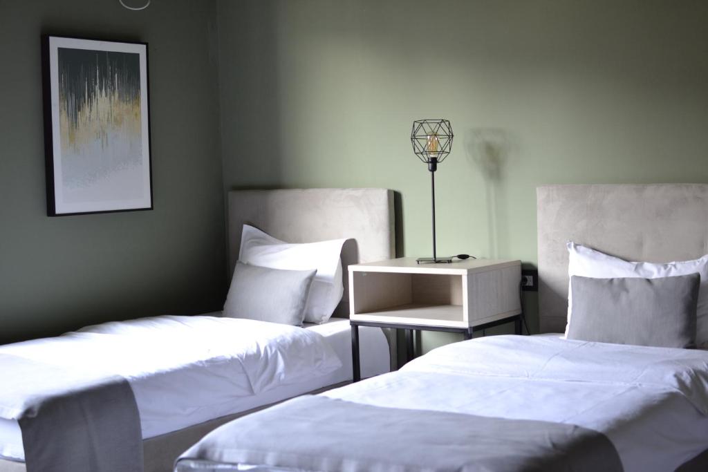 Postel nebo postele na pokoji v ubytování Hotel Pamela Concept