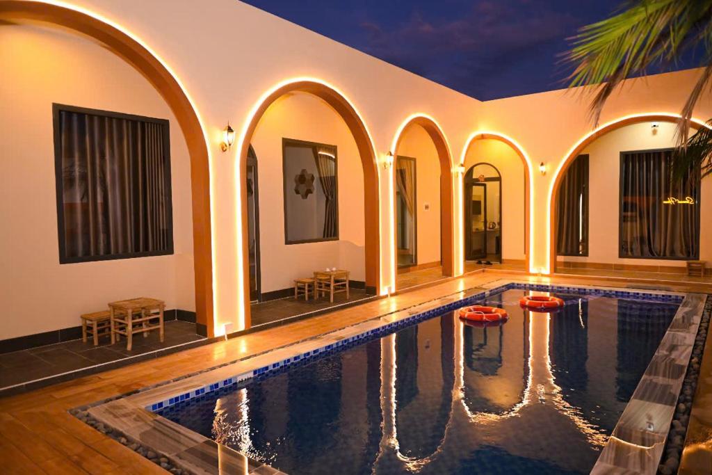 an indoor swimming pool in a house with an indoor swimming poolvisor at Second house in Ấp Khánh Phước (1)