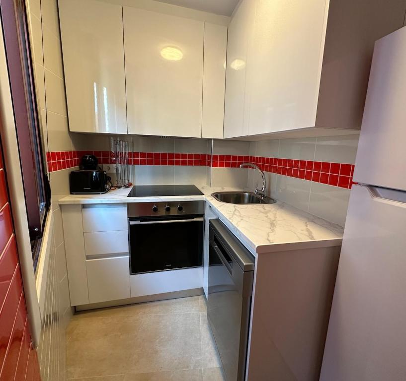 Kuchyň nebo kuchyňský kout v ubytování Apartamento vacacional Brisas de Galicia -Rías Baixas-