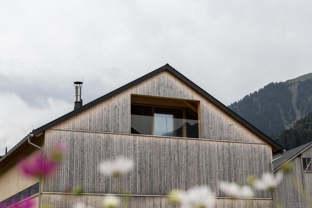 a house with a window on the side of it at Beerenhus in Au im Bregenzerwald