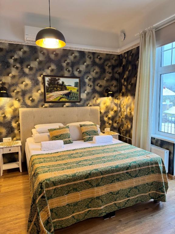 Postel nebo postele na pokoji v ubytování Green Villa