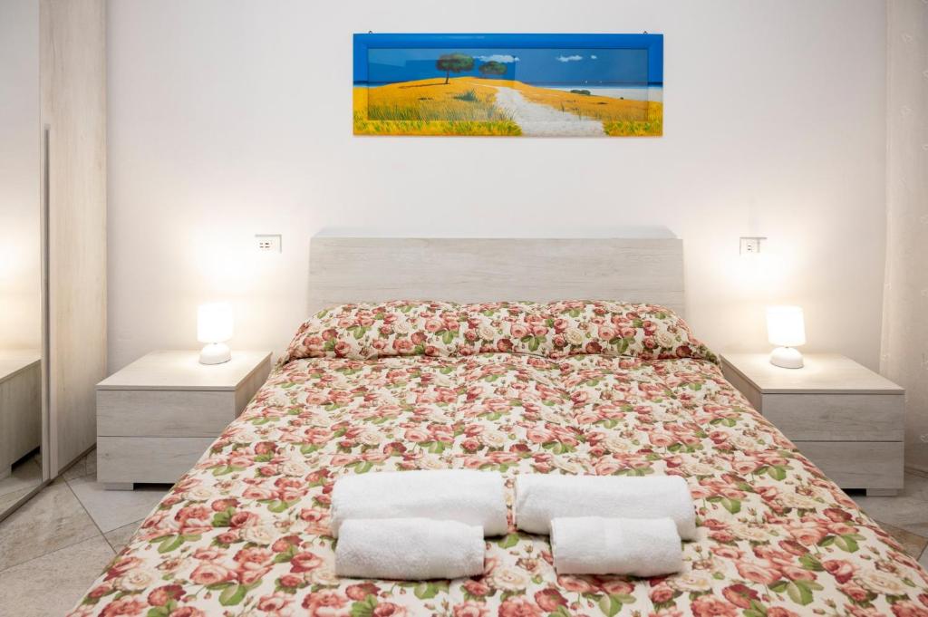 Postel nebo postele na pokoji v ubytování LE MURA Station Modern House - Parcheggio & Wi-Fi Gratis