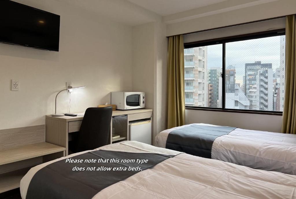 Postel nebo postele na pokoji v ubytování Le Tour Hotel Akihabara Kanda 楽途ホテル神田秋葉原