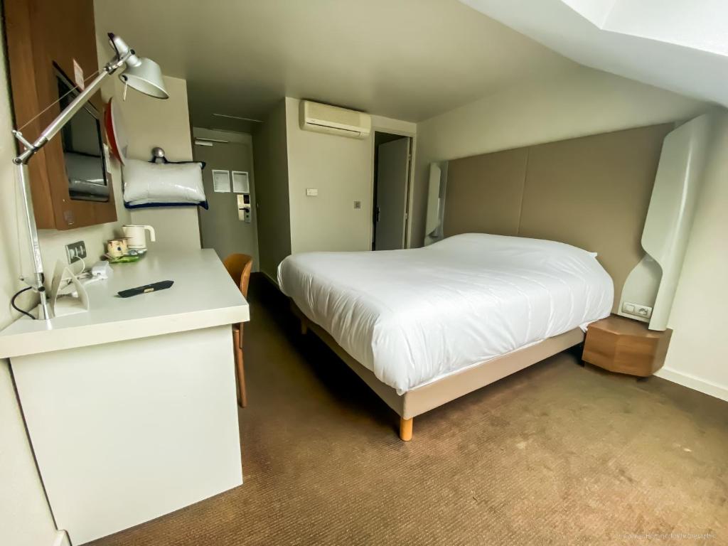 Postel nebo postele na pokoji v ubytování Campanile Montargis - Amilly