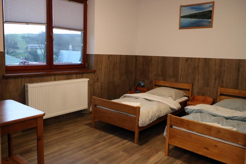 Posteľ alebo postele v izbe v ubytovaní Pokoje w Moszczenicy U Pasonia