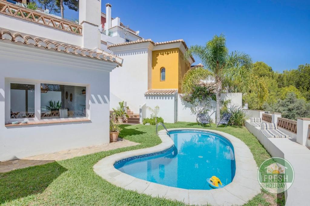 an image of a villa with a swimming pool at Casa Lagarto - villa with pool and jacuzzi in Almuñécar