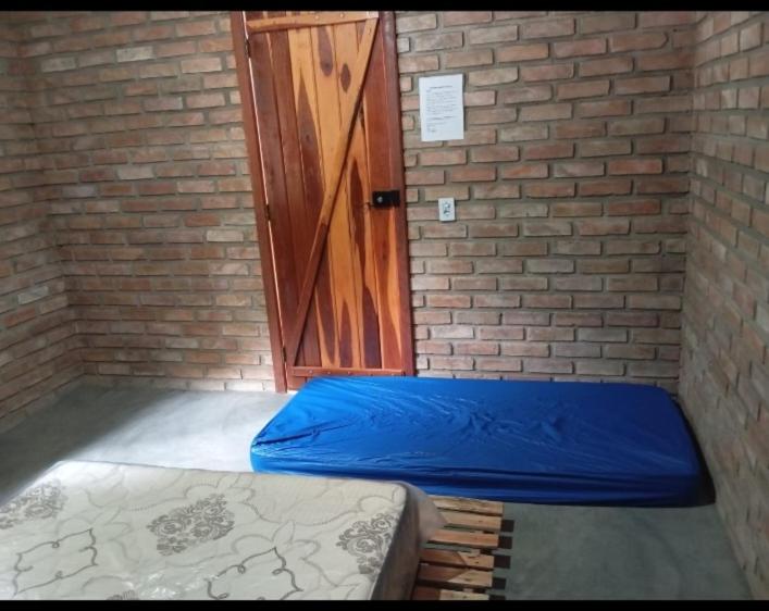 Postel nebo postele na pokoji v ubytování Cantinho HAKUNA MATATA-Vale do Capão a 5 min da Vila