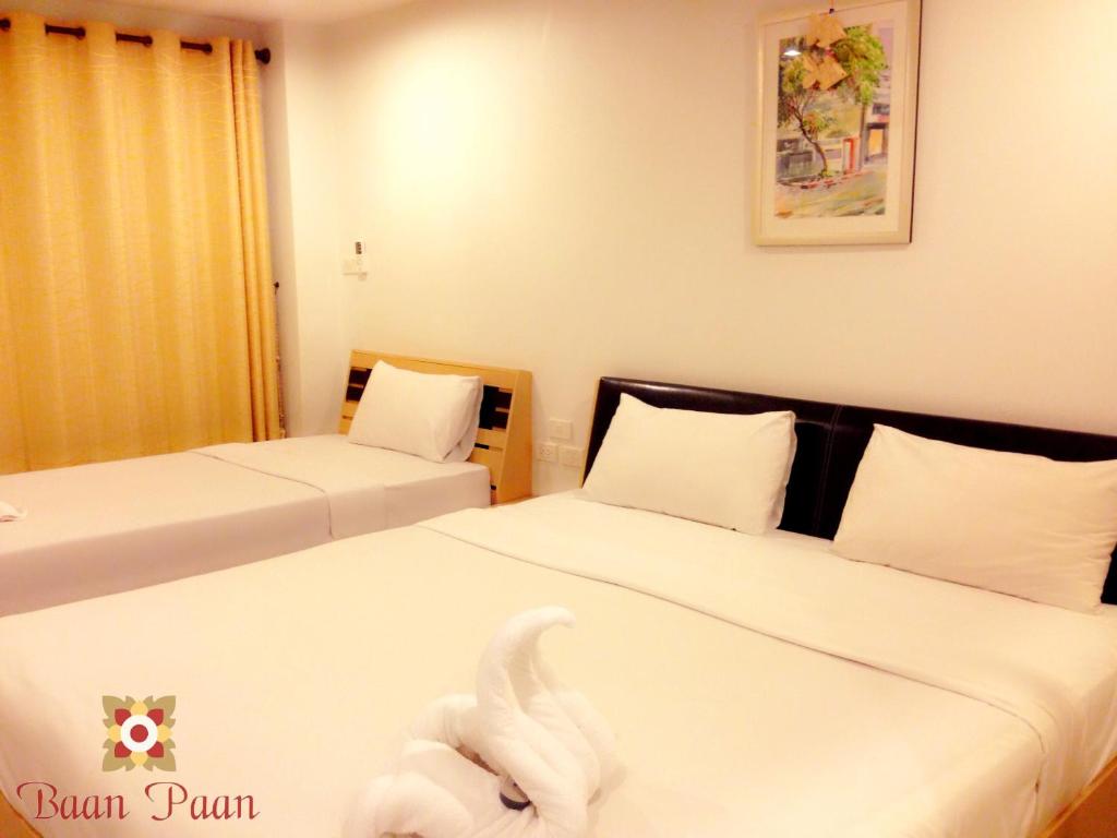 Postel nebo postele na pokoji v ubytování Baan Paan Hua Hin