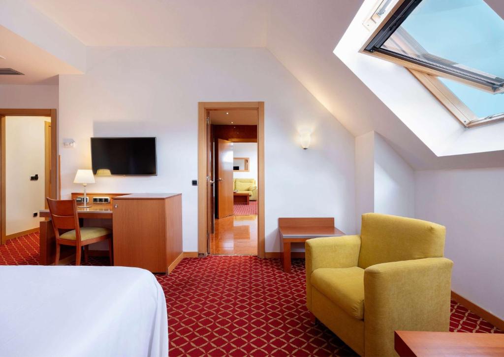TV a/nebo společenská místnost v ubytování Hotel Zentral León