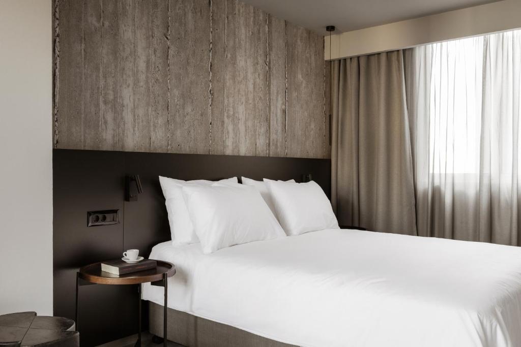Voodi või voodid majutusasutuse Alassia Hotel toas