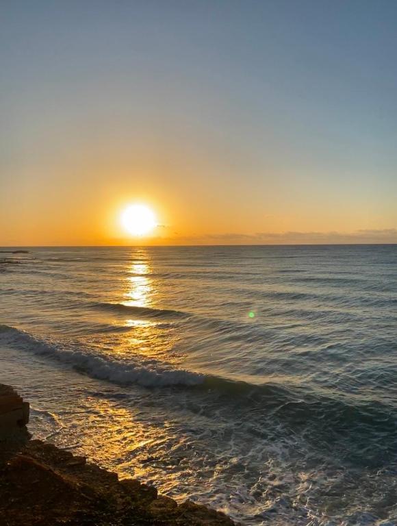 a sunset over the ocean with the sun setting at Heavenly Homes Mojacar 4 in Mojácar