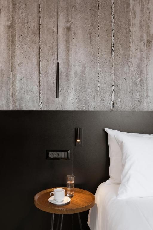 Voodi või voodid majutusasutuse Alassia Hotel toas