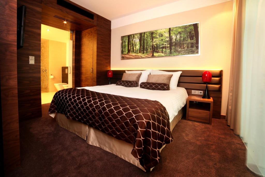 Postel nebo postele na pokoji v ubytování Hotel Narvil Conference & Spa