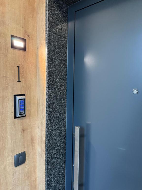 a door to a building with a sign on it at Luxury apartment Gabi 1 in Slavonski Brod
