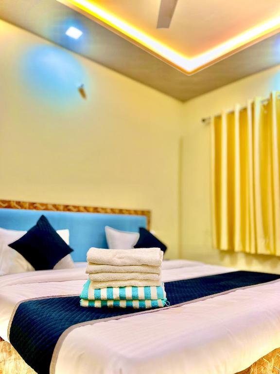 Postel nebo postele na pokoji v ubytování Hotel Agra YS Taj Hotel