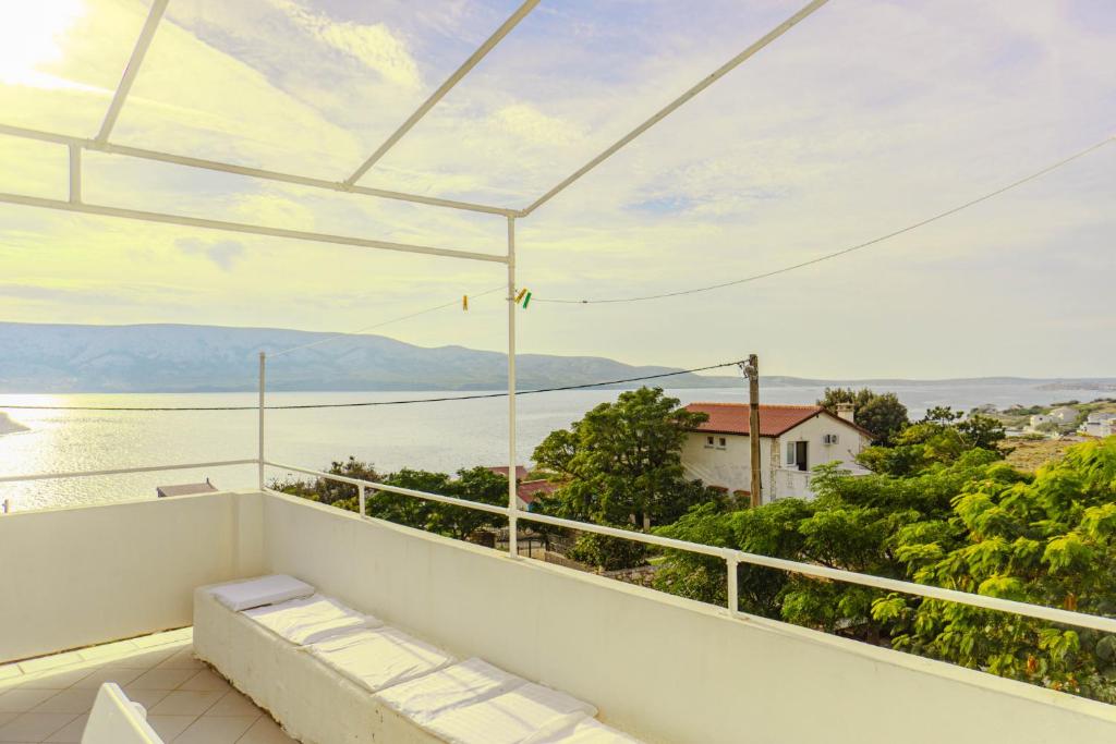 a balcony with a view of the water at Zeljana in Metajna