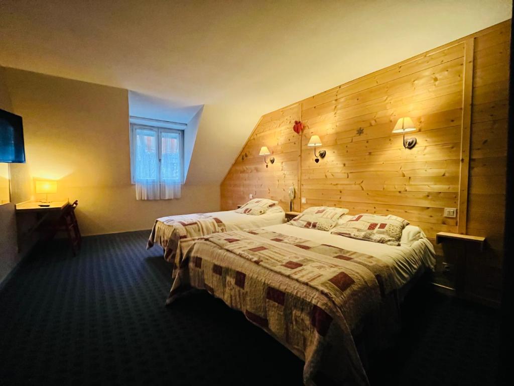 Postel nebo postele na pokoji v ubytování Hotel le Sacca, nouvelle équipe