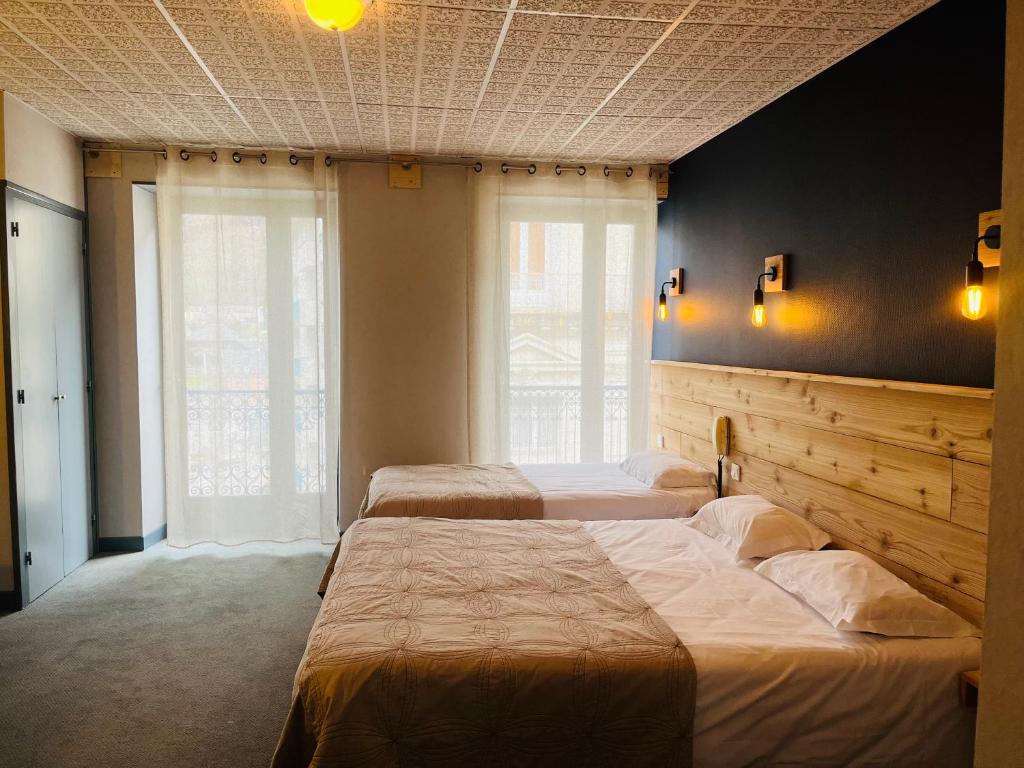 Postel nebo postele na pokoji v ubytování Hotel le Sacca, nouvelle équipe