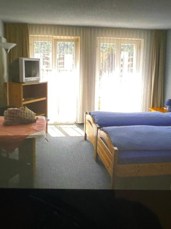 Postel nebo postele na pokoji v ubytování Hotel ilufa